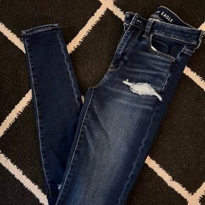 Dark wash ripped American Eagle jeans, never worn, size 4 long